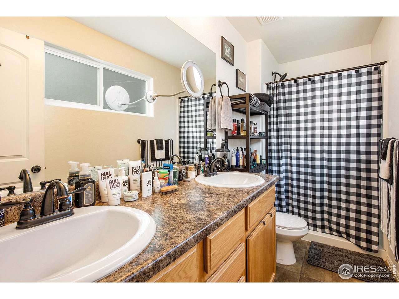 1329 85th Avenue Greeley, CO 80634 - Photo 13 of 22 a bathroom with a sink and a mirror