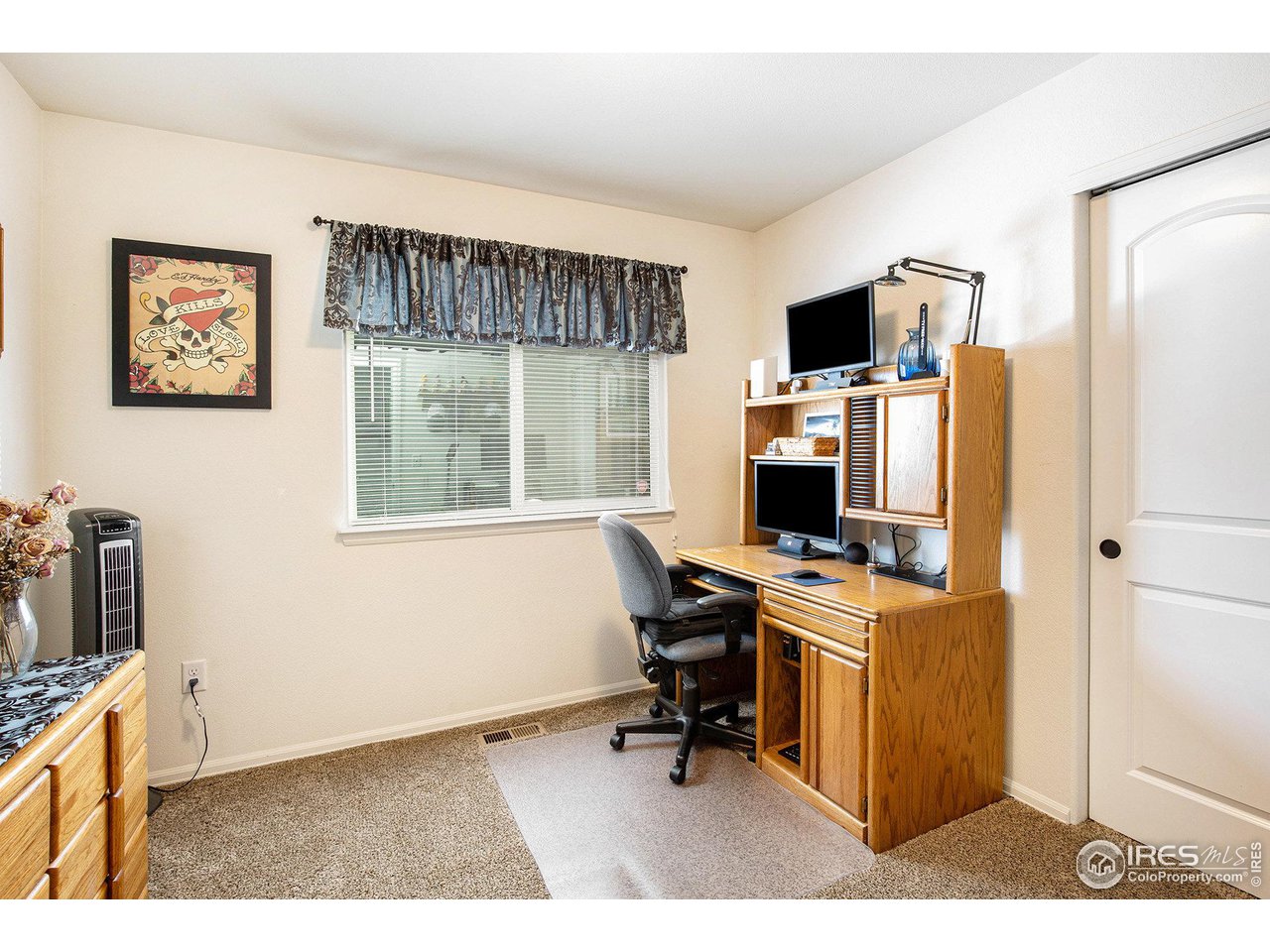 1329 85th Avenue Greeley, CO 80634 - Photo 15 of 22 a view of a workspace with furniture and a window