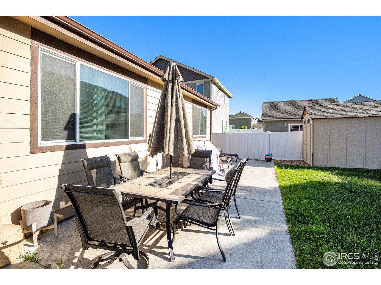 1329 85th Avenue Greeley, CO 80634 - Photo 20 of 22 a patio with table and chairs