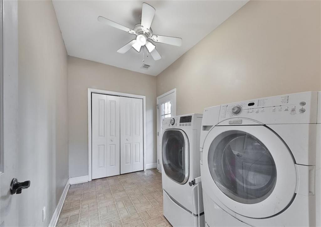 1523 Braswell Mountain Road Dallas, GA 30132 - Photo 13 of 34 a view of a washer and dryer in a room