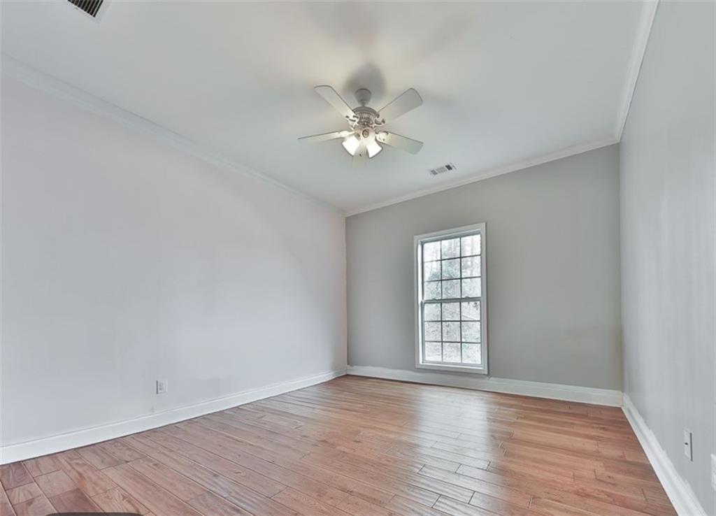 1523 Braswell Mountain Road Dallas, GA 30132 - Photo 15 of 34 wooden floor in an empty room with a window