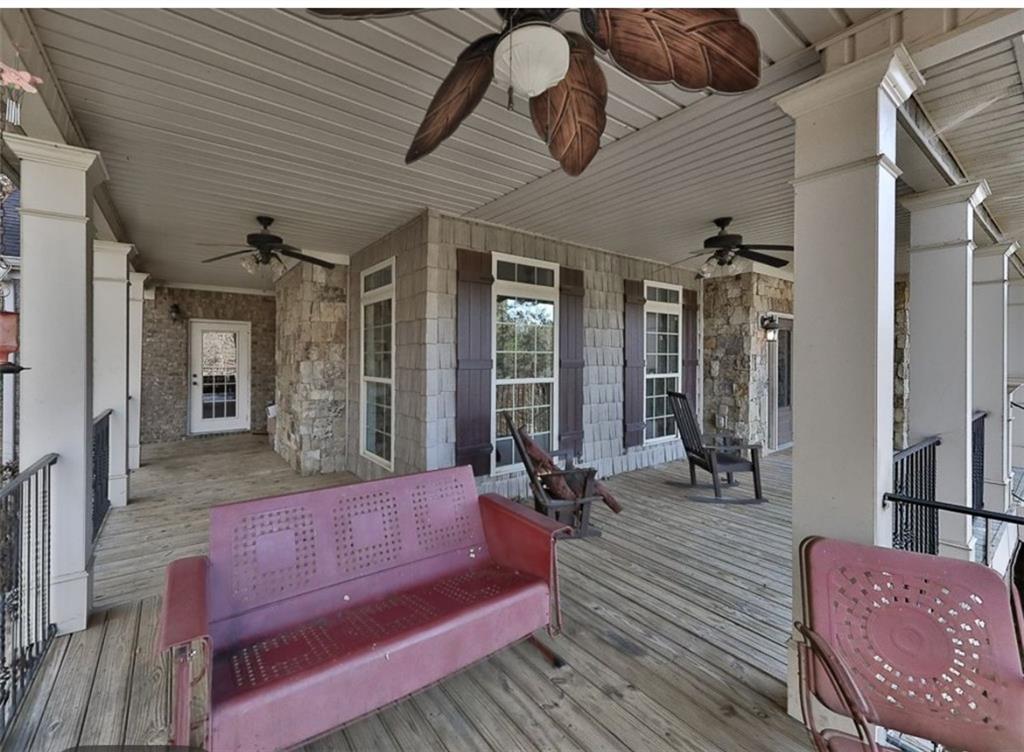 1523 Braswell Mountain Road Dallas, GA 30132 - Photo 25 of 34 a outdoor space with patio the couches and a potted plant with outer view
