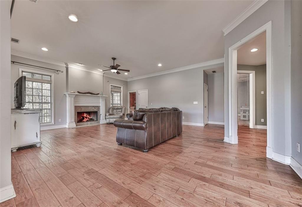 1523 Braswell Mountain Road Dallas, GA 30132 - Photo 4 of 34 a living room with furniture and a fireplace