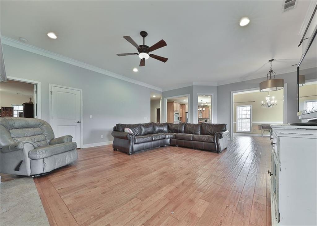 1523 Braswell Mountain Road Dallas, GA 30132 - Photo 5 of 34 a living room with furniture and a wooden floor