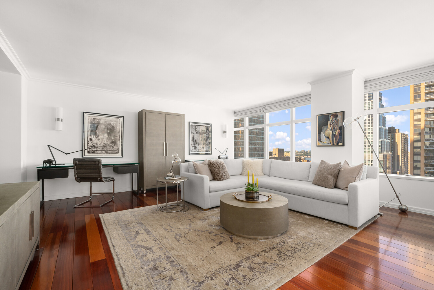 160 West 66th Street, Unit 31D Manhattan, NY 10023 - Photo 2 of 10 a living room with furniture wooden floor and a large window