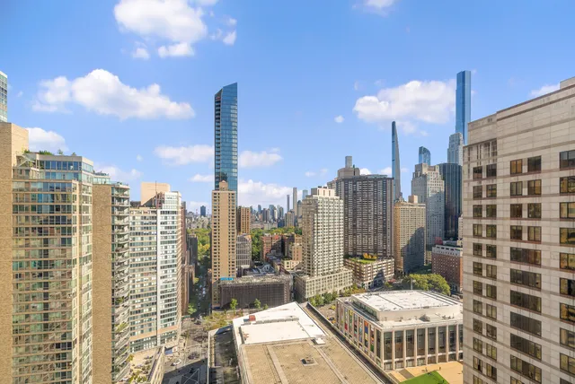 a view of a city with tall buildings