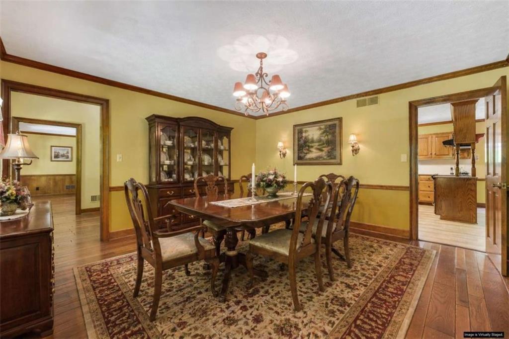 314 Winding Stream Trail Southwest Conyers, GA 30094 - Photo 5 of 59 a view of a dining room with furniture wooden floor and chandelier