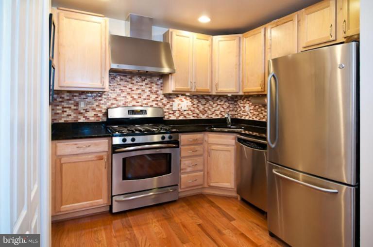 1437 Spring Road Northwest, Unit 32 Washington, DC 20010 - Photo 10 of 15 Granite, stainless steel, glass tile