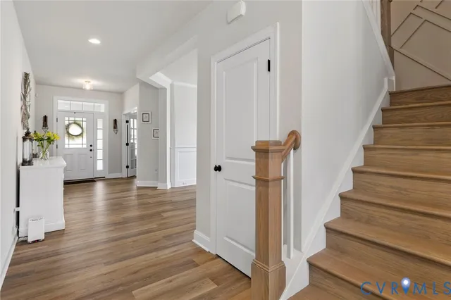 a view of a livingroom with furniture and stairs