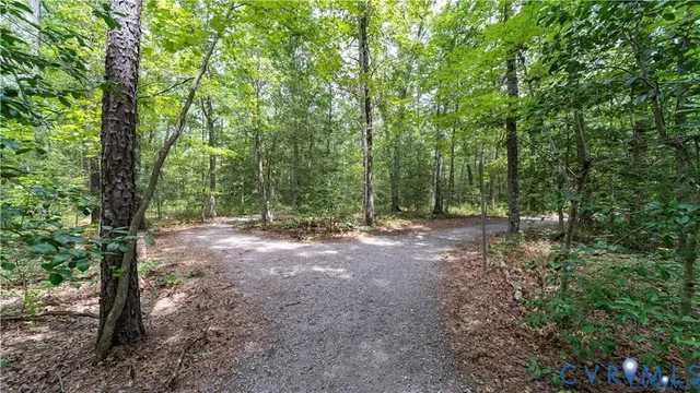 a view of a swimming pool with a yard