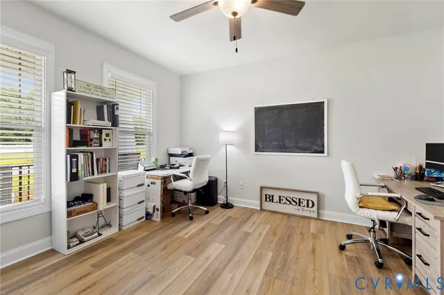 a view of a dining room with furniture and a chandelier