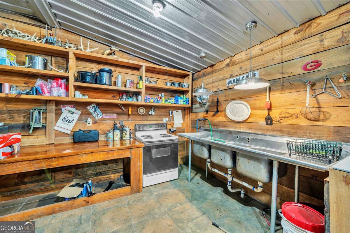 568 Hopewell Church Road Rhine, GA 31077 - Photo 52 of 79 a utility room with stainless steel appliances and cabinets