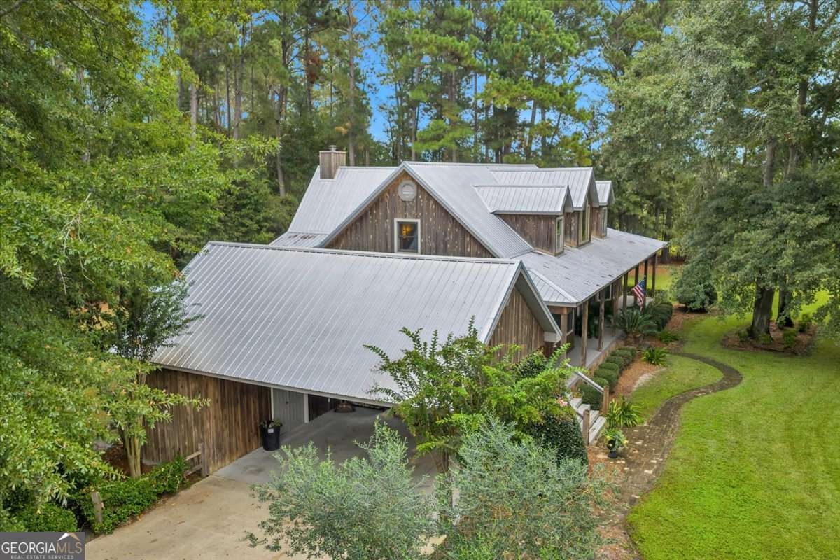 568 Hopewell Church Road Rhine, GA 31077 - Photo 67 of 79 a aerial view of a house with a yard table and chairs