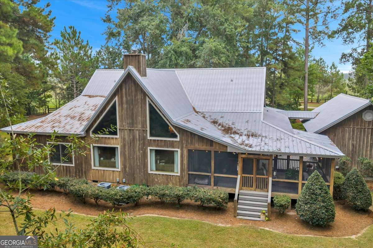 568 Hopewell Church Road Rhine, GA 31077 - Photo 69 of 79 an aerial view of a house with swimming pool and glass doors