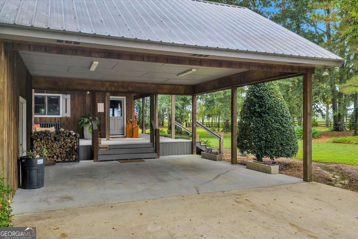 568 Hopewell Church Road Rhine, GA 31077 - Photo 70 of 79 a backyard of a house with garden and outdoor seating
