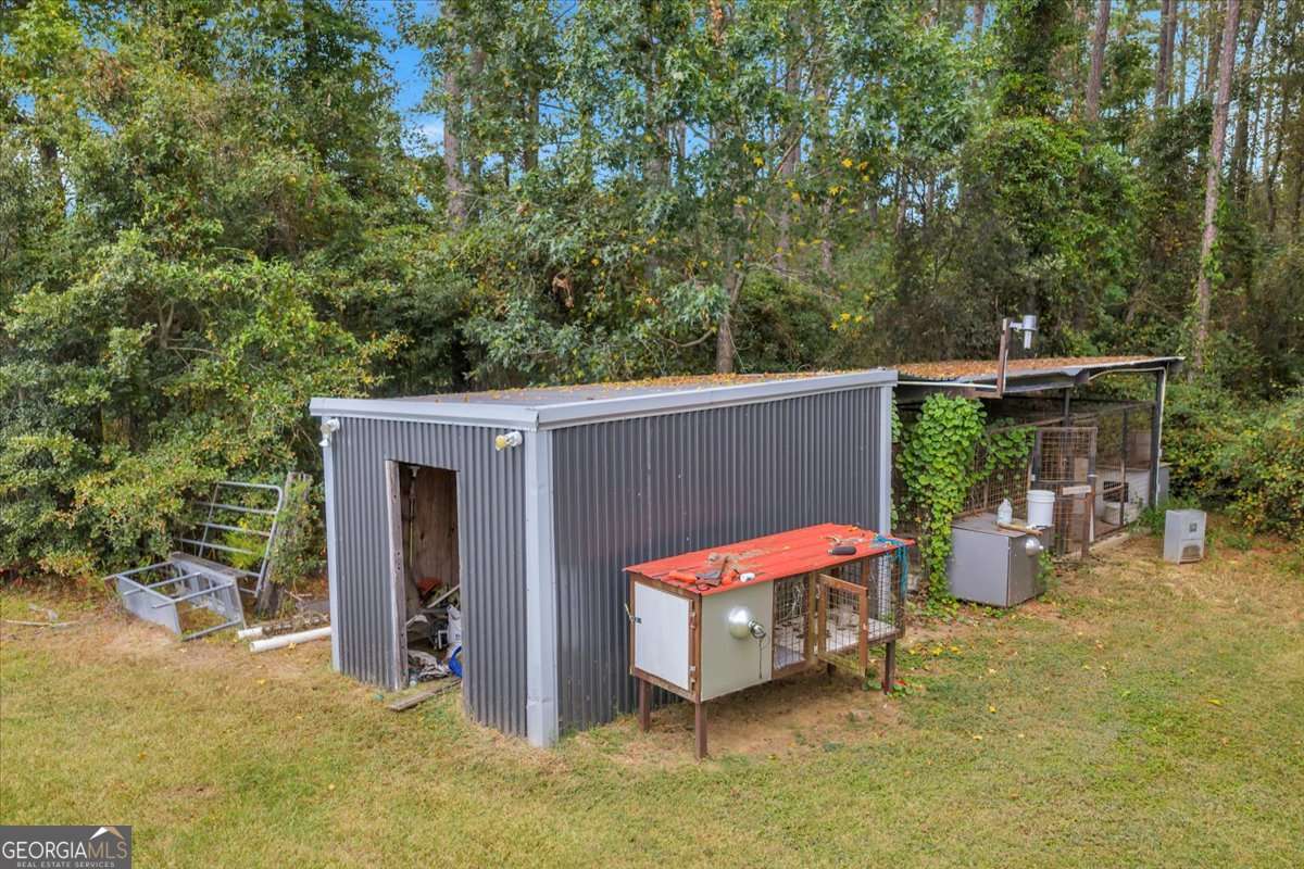 568 Hopewell Church Road Rhine, GA 31077 - Photo 74 of 79 a backyard of a house with yard and outdoor seating
