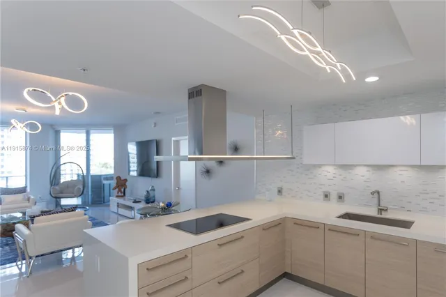 a kitchen with a sink cabinets and window