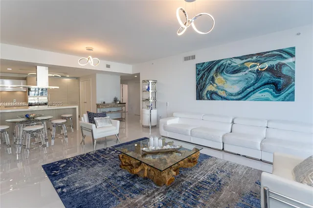 a living room with furniture and a rug