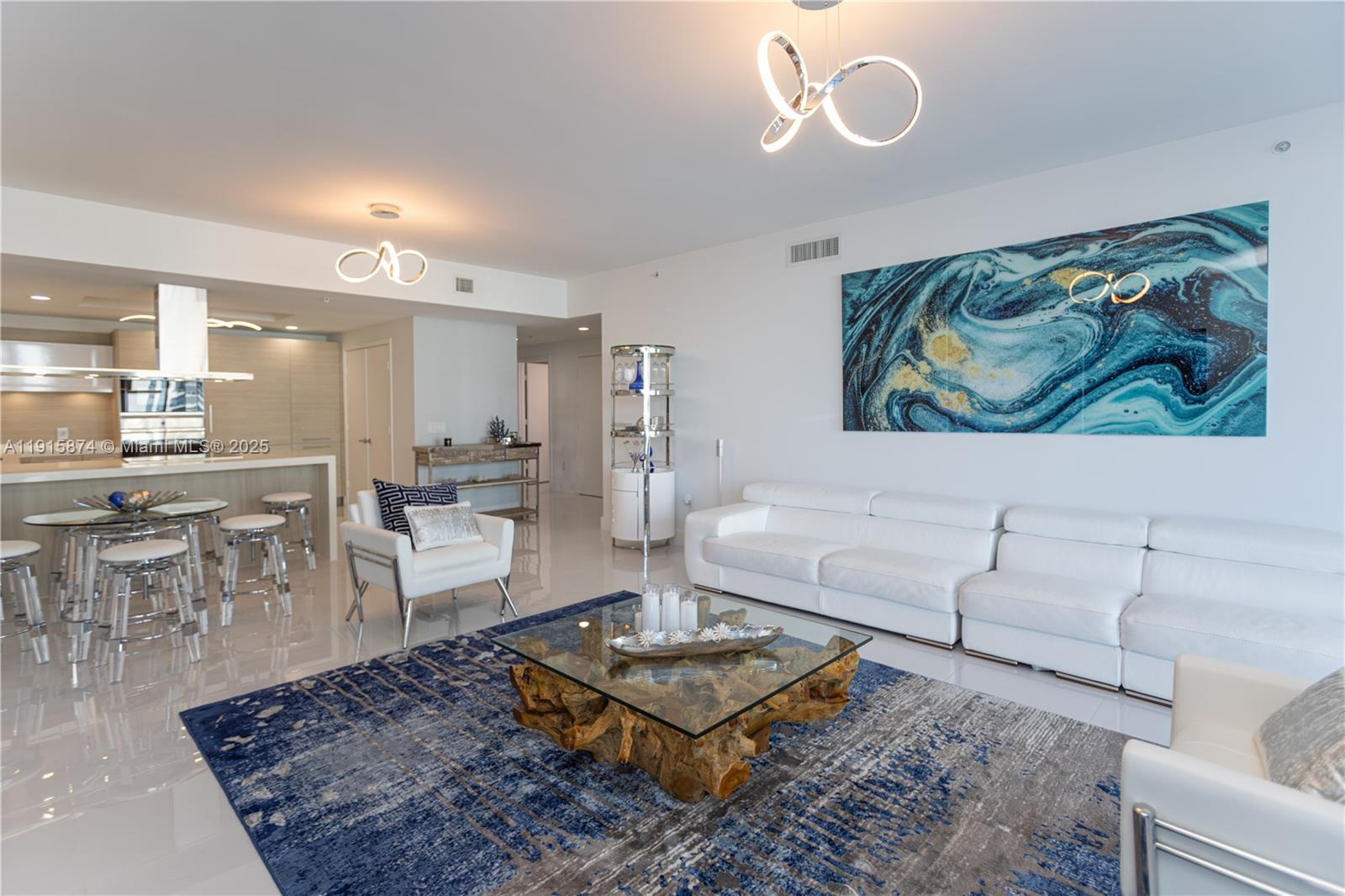 17111 Biscayne Boulevard, Unit 505 North Miami Beach, FL 33160 - Photo 20 of 29 a living room with furniture and a rug