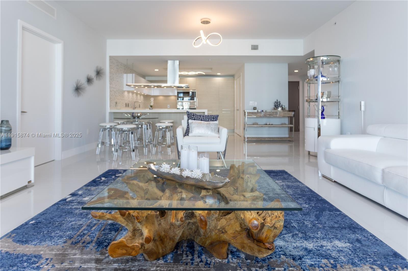 17111 Biscayne Boulevard, Unit 505 North Miami Beach, FL 33160 - Photo 21 of 29 a living room with furniture and a rug