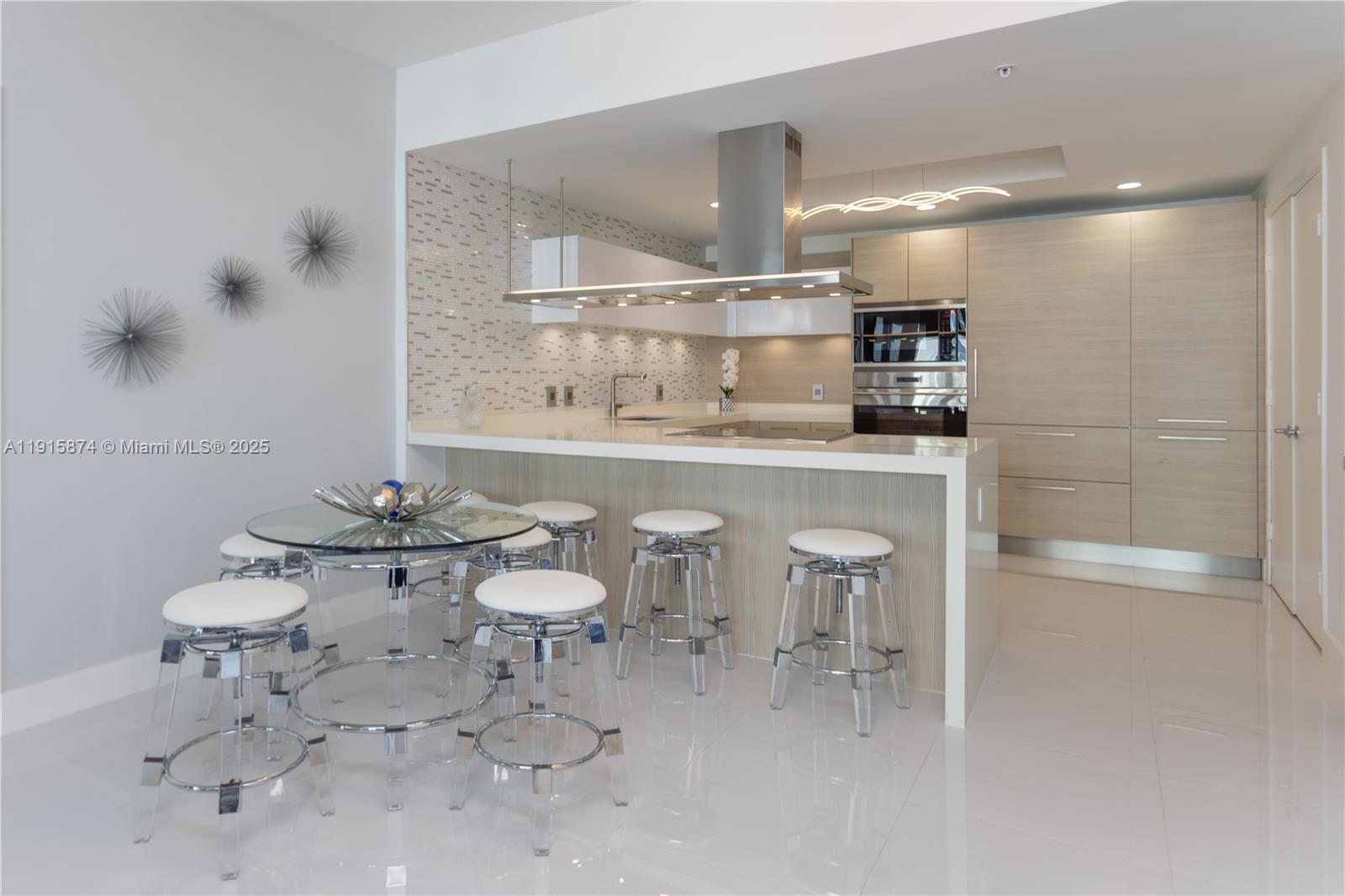 17111 Biscayne Boulevard, Unit 505 North Miami Beach, FL 33160 - Photo 22 of 29 a bathroom with a sink toilet and a mirror