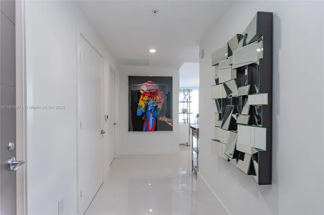 wooden floor with white wall and closet