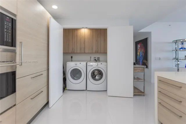 a view of a livingroom with furniture and staircase