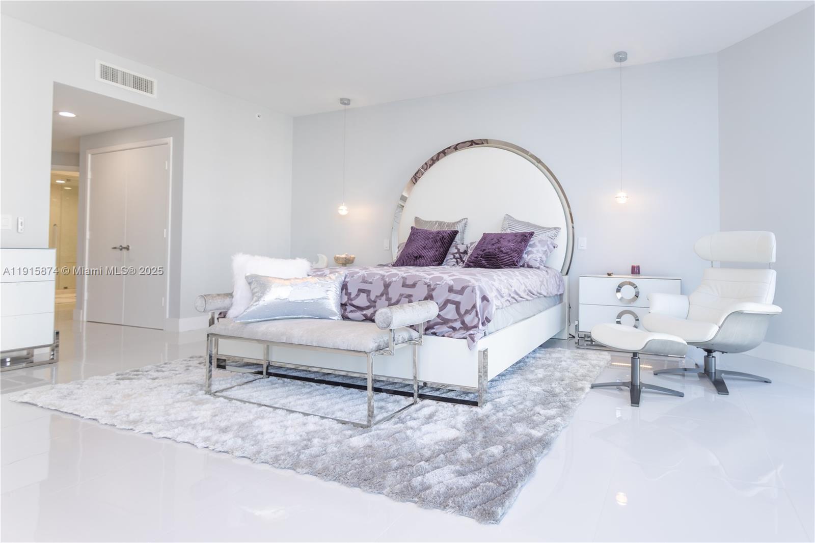 17111 Biscayne Boulevard, Unit 505 North Miami Beach, FL 33160 - Photo 3 of 29 a bedroom with a bed and a couch