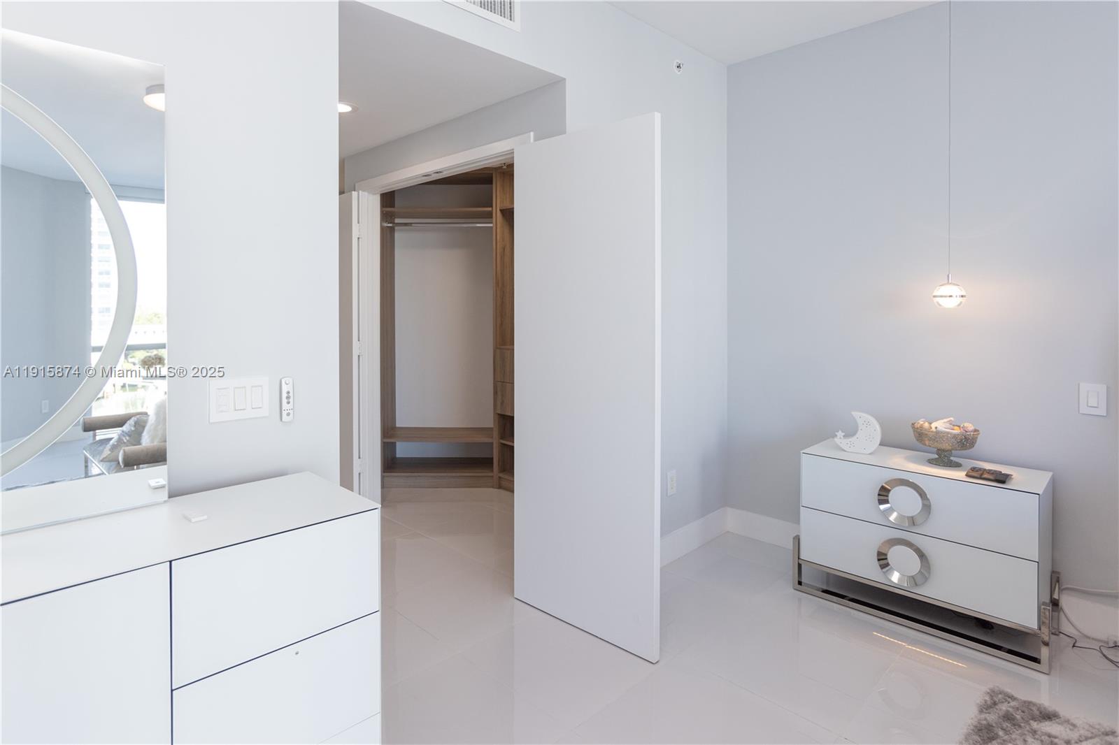 17111 Biscayne Boulevard, Unit 505 North Miami Beach, FL 33160 - Photo 7 of 29 a room with a washing machine