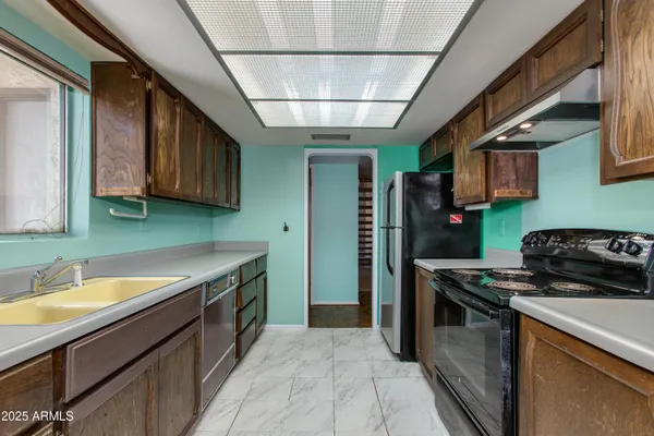 a room with cabinets and a chair