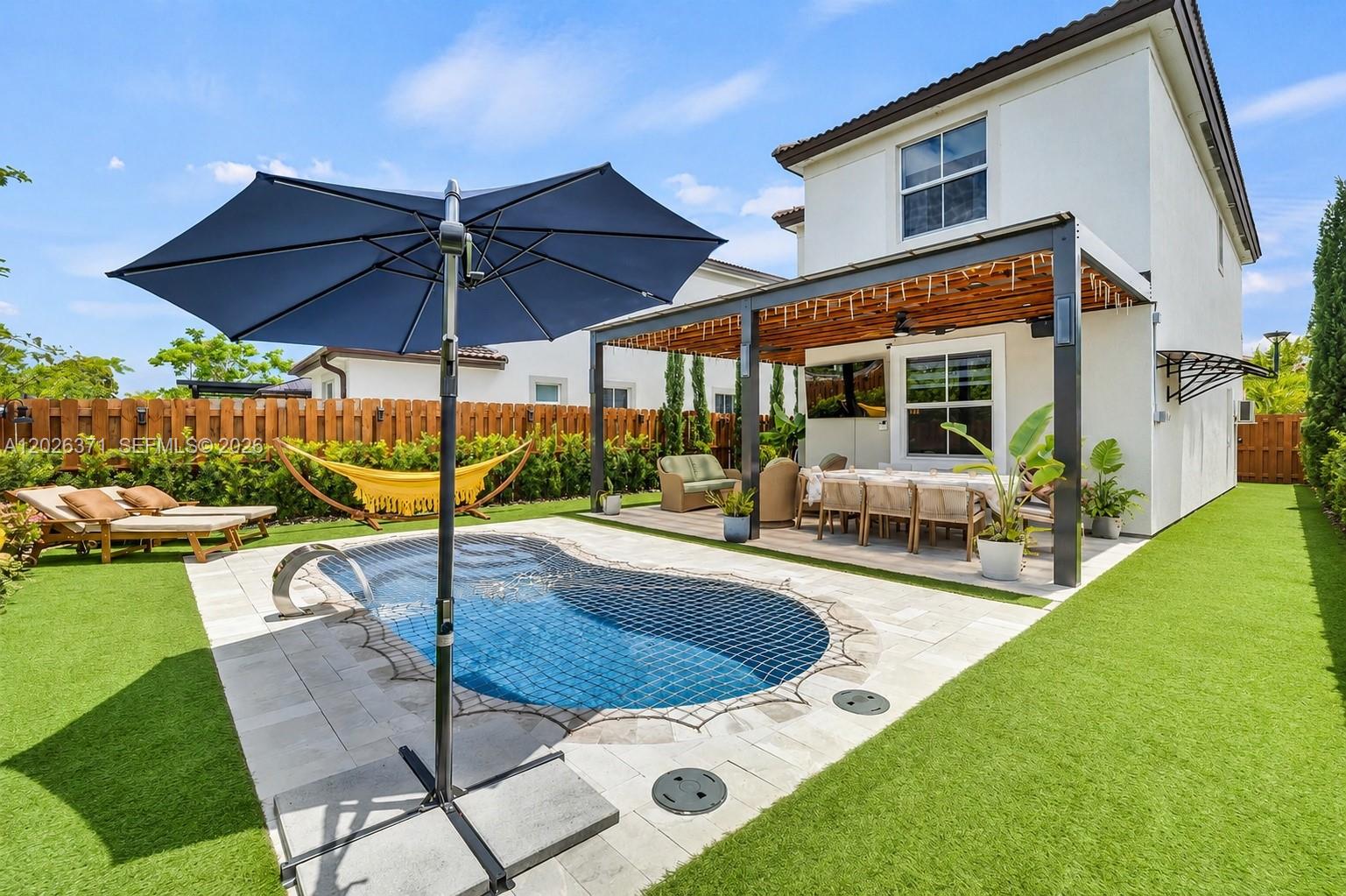 2273 Northwest 131st Circle Miami, FL 33167 - Photo 1 of 46 a view of a house with backyard porch and furniture