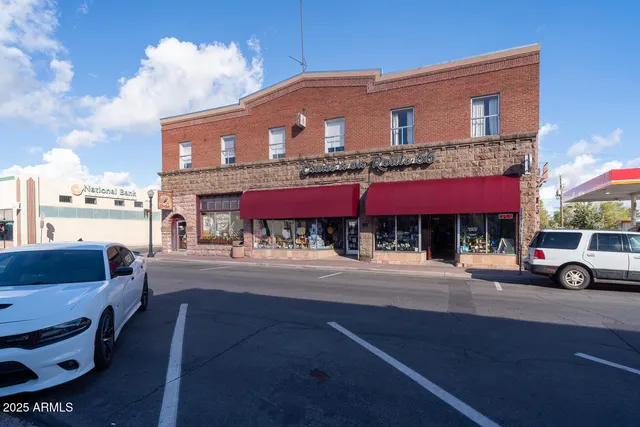 a bed sitting in a room next to a window