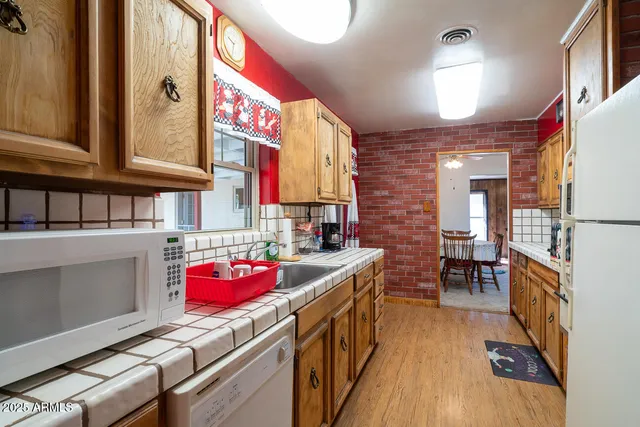 a view of a house with a large tree
