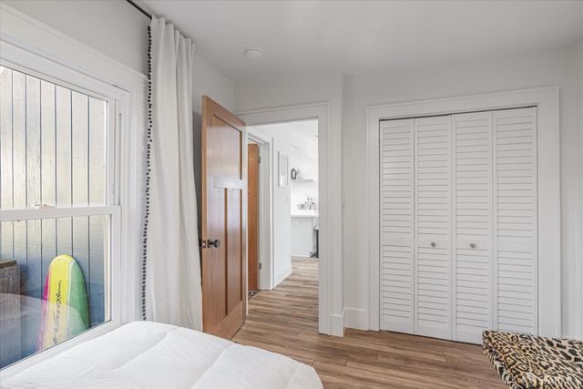 a view of a bedroom with a lounge chair