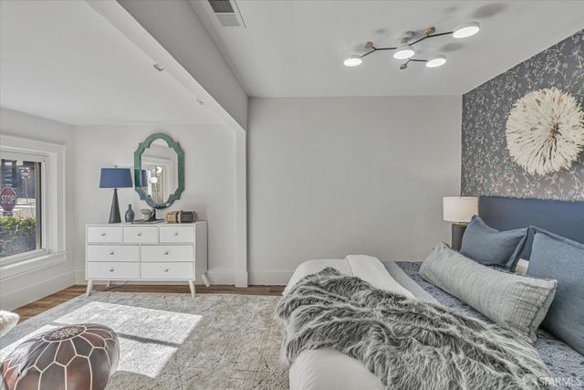 a bedroom with a bed and a dresser