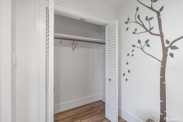 a view of an entryway with wooden floor