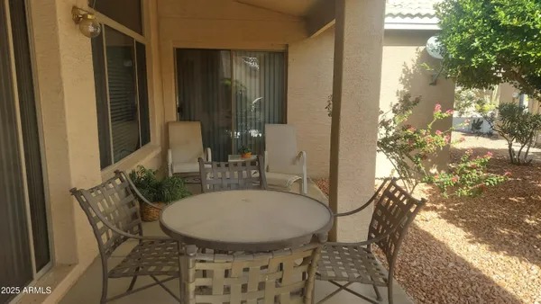 a table and chairs in a patio