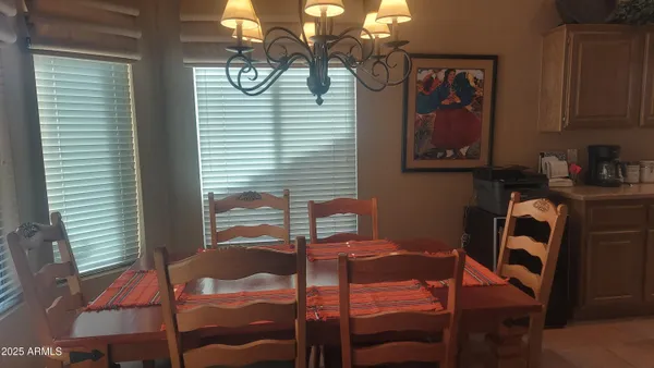 a dining room with furniture and window