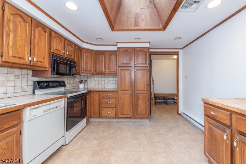 20 Wanaque Road West Milford, NJ 07421 - Photo 7 of 31 a kitchen with stainless steel appliances granite countertop a refrigerator stove and sink