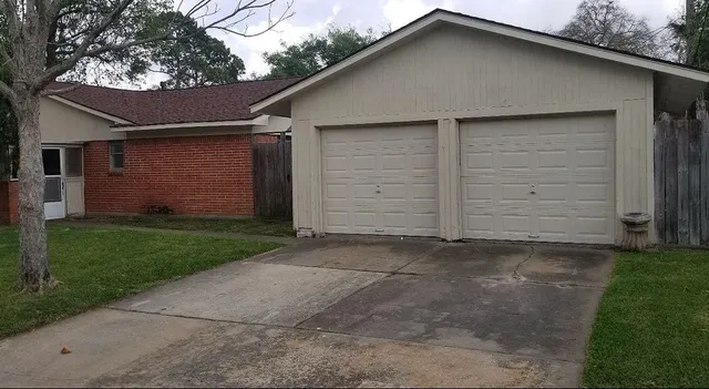 a front view of a house with a garage