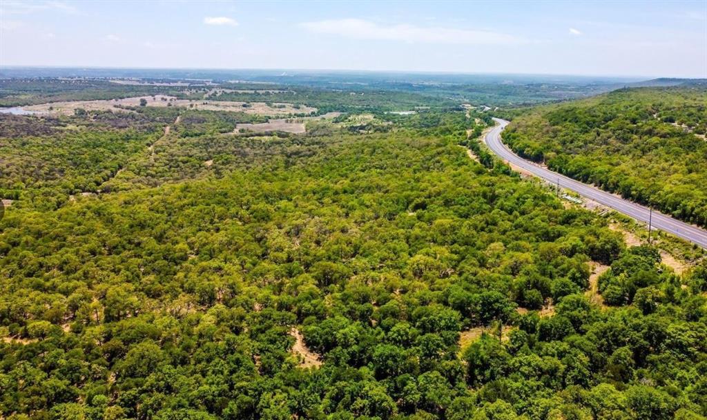 281 Tract 1 Mineral Wells Mineral Wells, TX 76067 - Photo 9 of 23 an aerial view of residential houses with outdoor space and trees