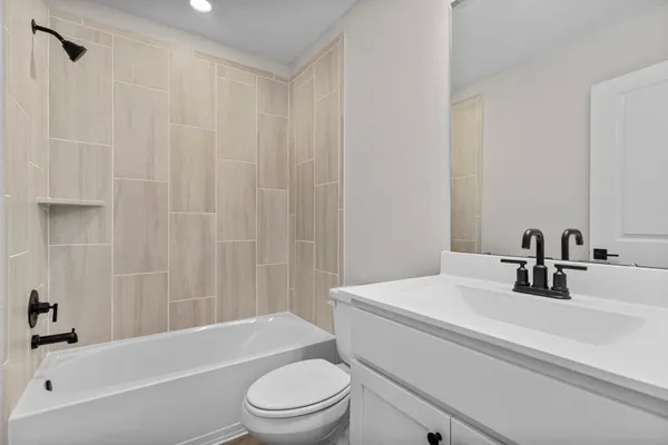 a bathroom with a sink a toilet and a bathtub