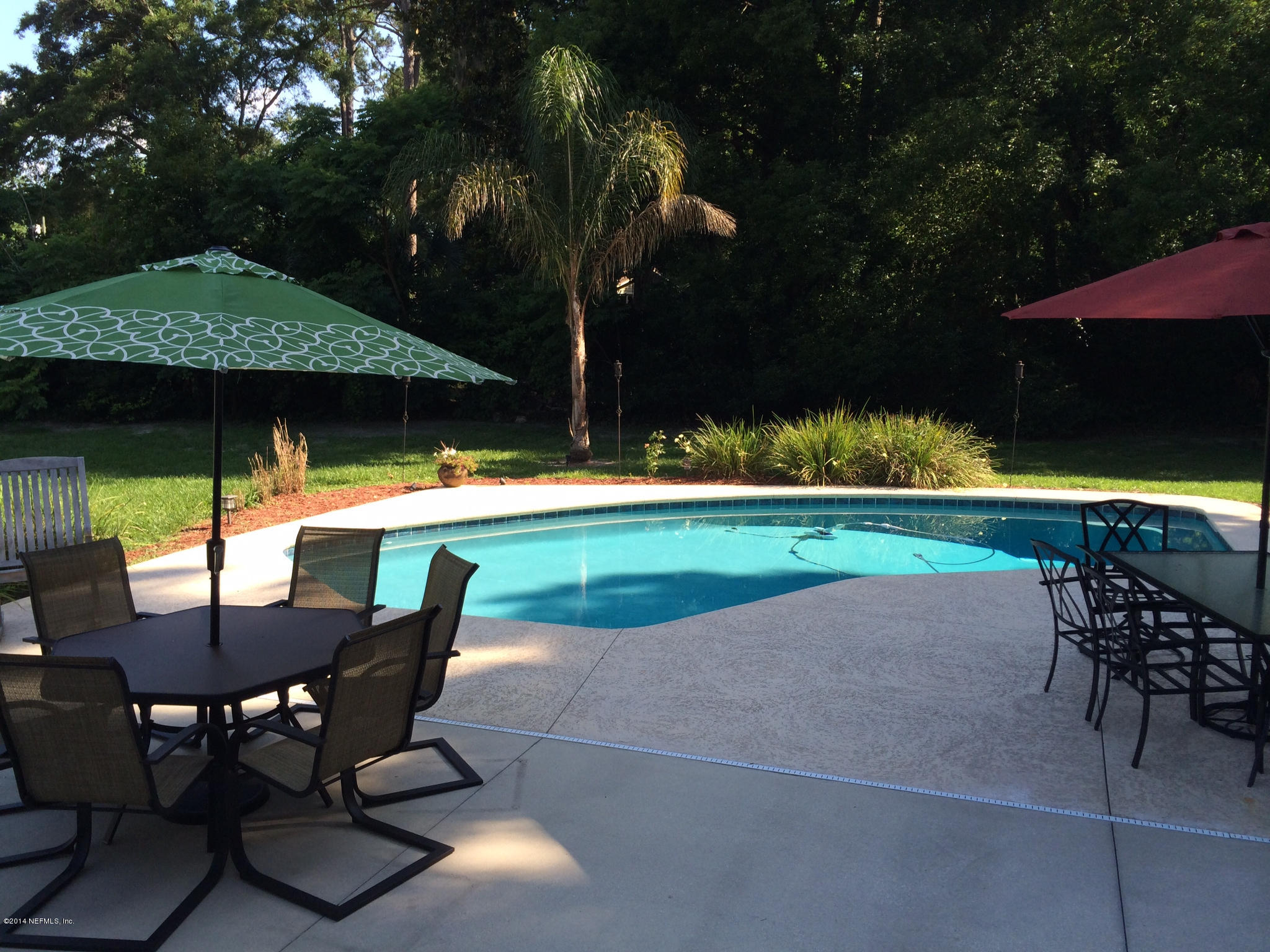 5114 Damascus Road South Jacksonville, FL 32207 - Photo 1 of 12 a patio with table and chairs