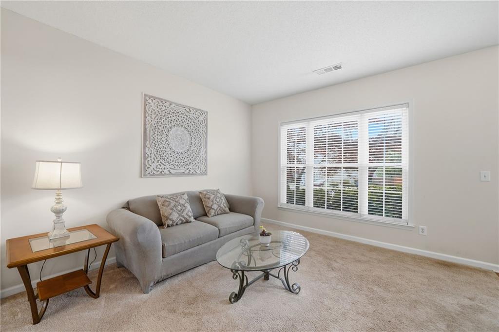 2135 Sugar Maple Lane Northwest Acworth, GA 30101 - Photo 12 of 59 a living room with furniture and a window