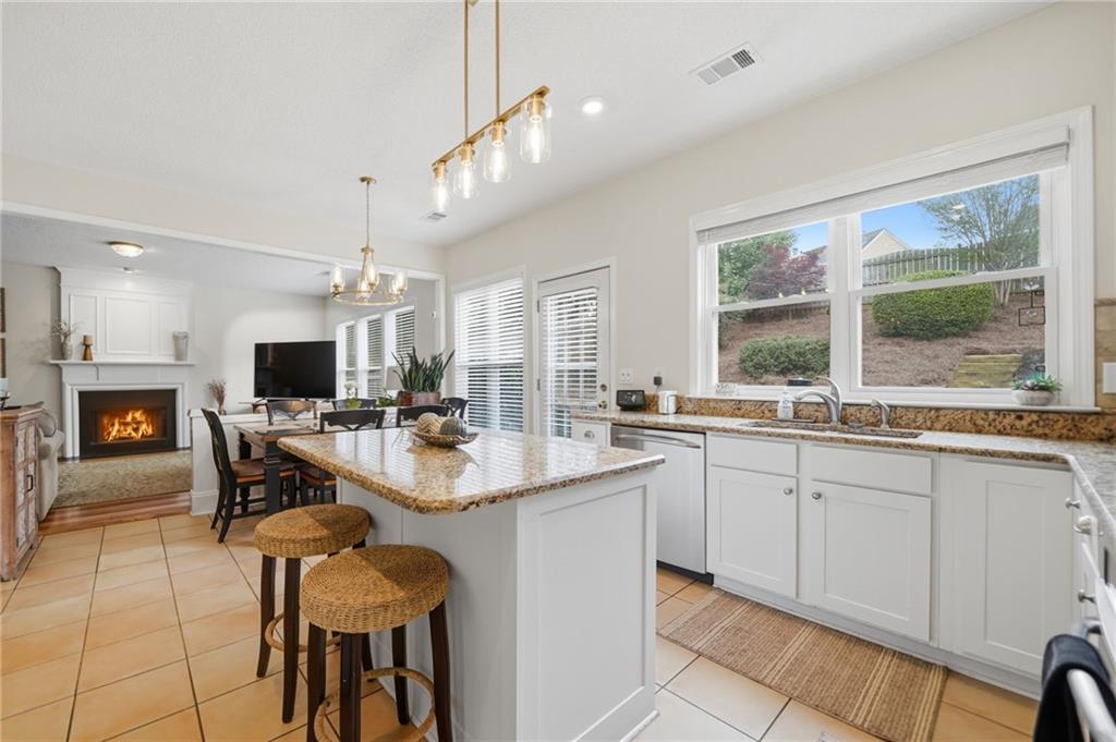 2135 Sugar Maple Lane Northwest Acworth, GA 30101 - Photo 14 of 59 a large kitchen with a table and chairs in it