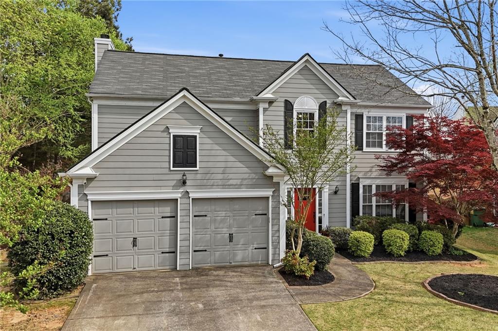 2135 Sugar Maple Lane Northwest Acworth, GA 30101 - Photo 2 of 59 a front view of a house with garden