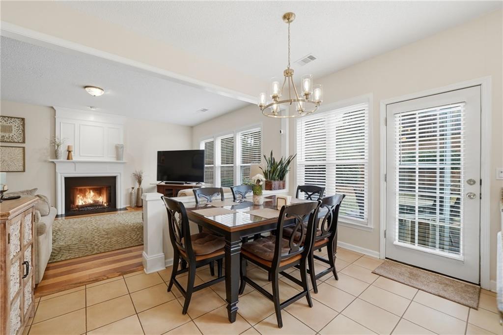 2135 Sugar Maple Lane Northwest Acworth, GA 30101 - Photo 22 of 59 a view of a dining room with furniture window and wooden floor