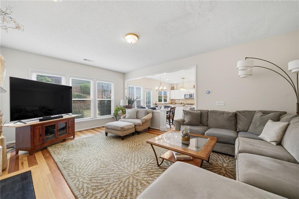 2135 Sugar Maple Lane Northwest Acworth, GA 30101 - Photo 25 of 59 a living room with furniture and a flat screen tv