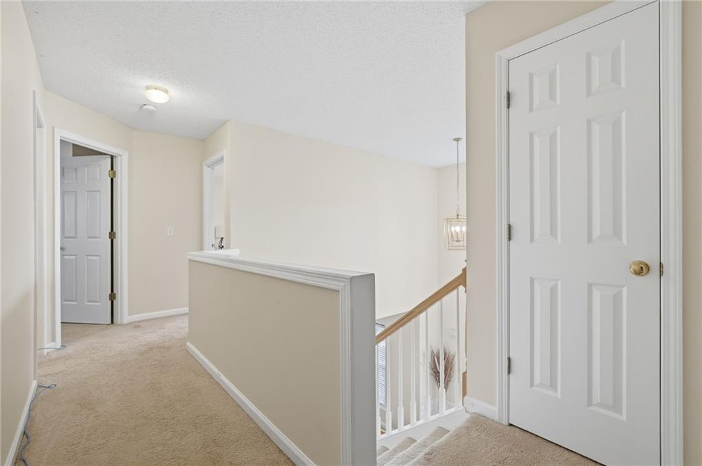 2135 Sugar Maple Lane Northwest Acworth, GA 30101 - Photo 26 of 59 a view of a hallway with staircase