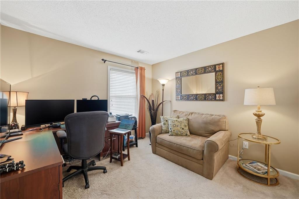 2135 Sugar Maple Lane Northwest Acworth, GA 30101 - Photo 28 of 59 a living room with furniture and a window